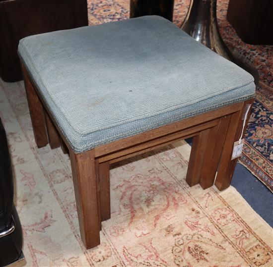 A nest of three Parker Knoll oak stools retailed by Heals Larger 48cm